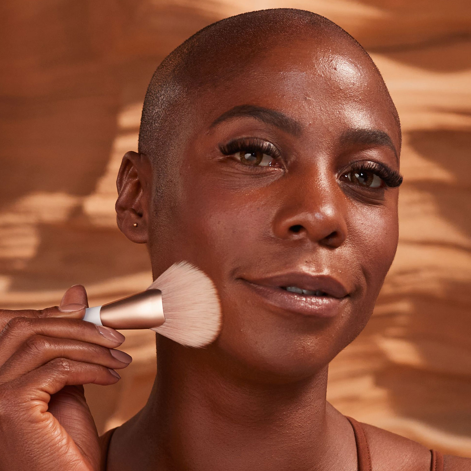 Woman using GloWish Airbrush